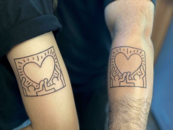 Brother and sister matching tattoos featuring heart and figures, symbolizing bond and unity.