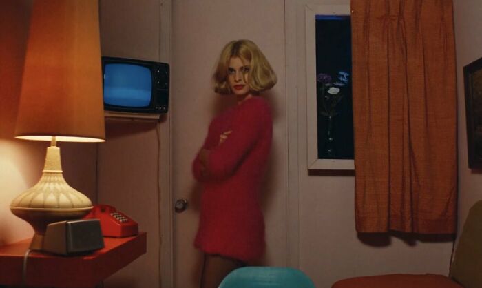 Jane wearing pink sweater 