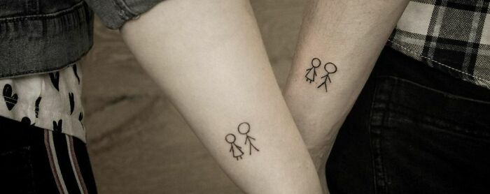Stick figure brother and sister tattoos on forearms, symbolizing inseparable bond.