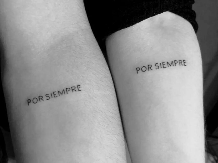 Brother and sister tattoos with matching "Por Siempre" text on forearms.