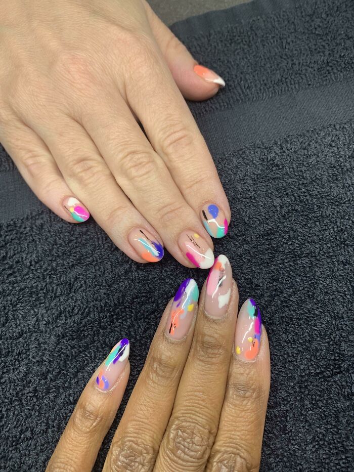 Colorful abstract nail art design showcasing vibrant, creative patterns, ideal for your next nail appointment.