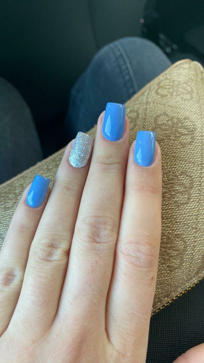 Blue and glittery nail art design, perfect for your next appointment.