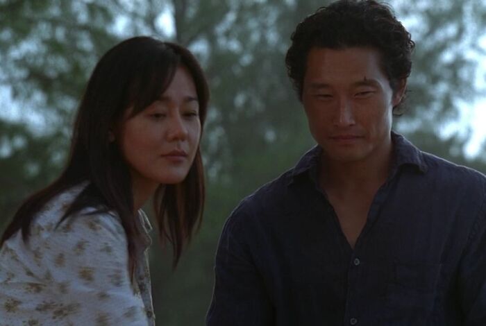 Sun wearing white shirt Jin wearing blue shirt 