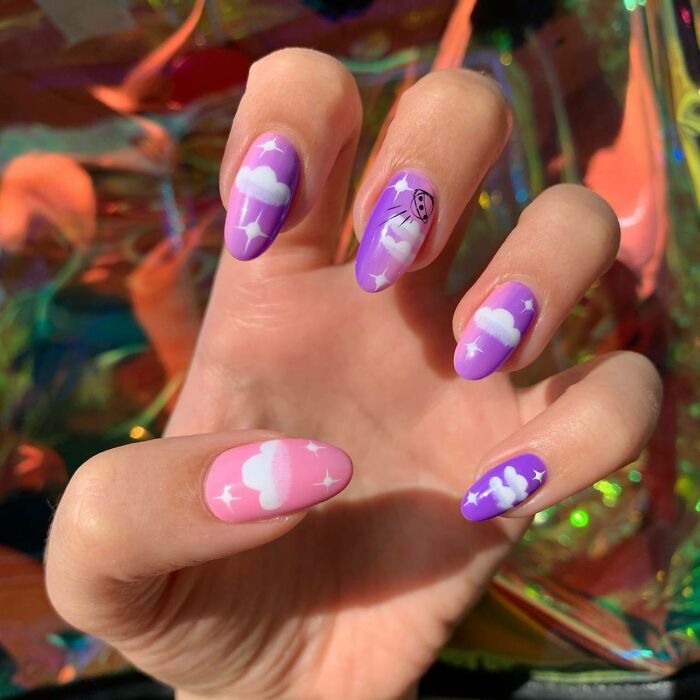 Colorful cloud nail art with a dreamy, pastel design. Perfect inspiration for your next nail appointment.