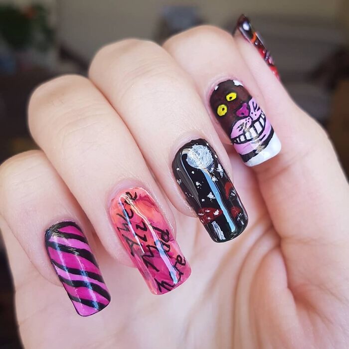 Colorful nail art ideas with cat design and text on fingers.