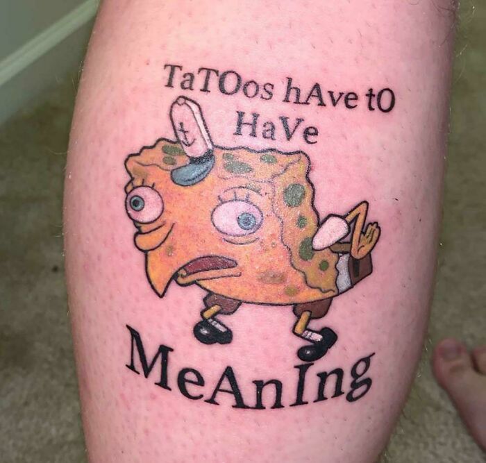 Tattoo of Spongebob Squarepants with text styled in alternating caps, showcasing an unusual design choice.