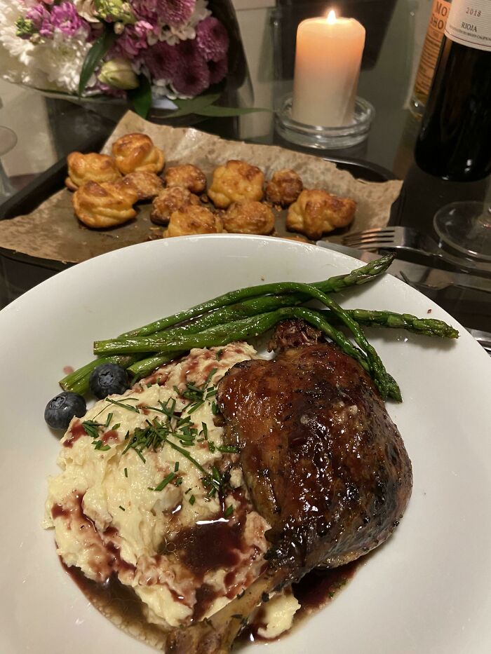 For Valentine's Day, I Made A Sous Vide Duck Confit On Parsnip Puree With A Red Wine Orange Reduction. In The Background Are Gougeres And French Cheese Choux Pastries