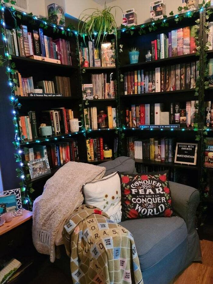 Grey chair surrounded by bookshelfs