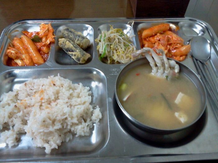 Plate with rice, soup and seafood