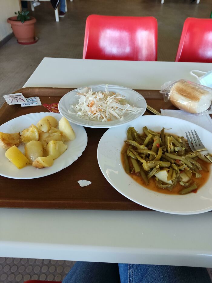 Plates with vegetables and potatoes on the table
