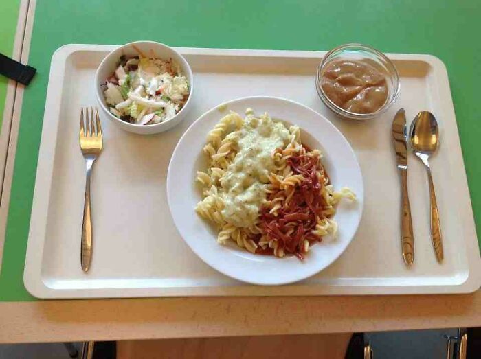 Plate with pasta, sauce and vegetables