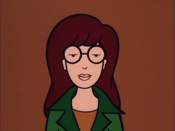 Alt text: Female cartoon character with glasses and a green jacket, showcasing fame and strength.