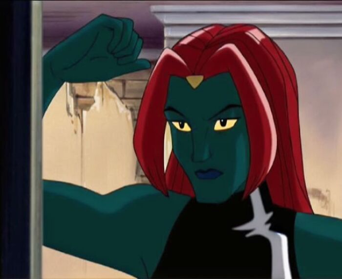 Female cartoon character with red hair and green skin showcasing strength and confidence.