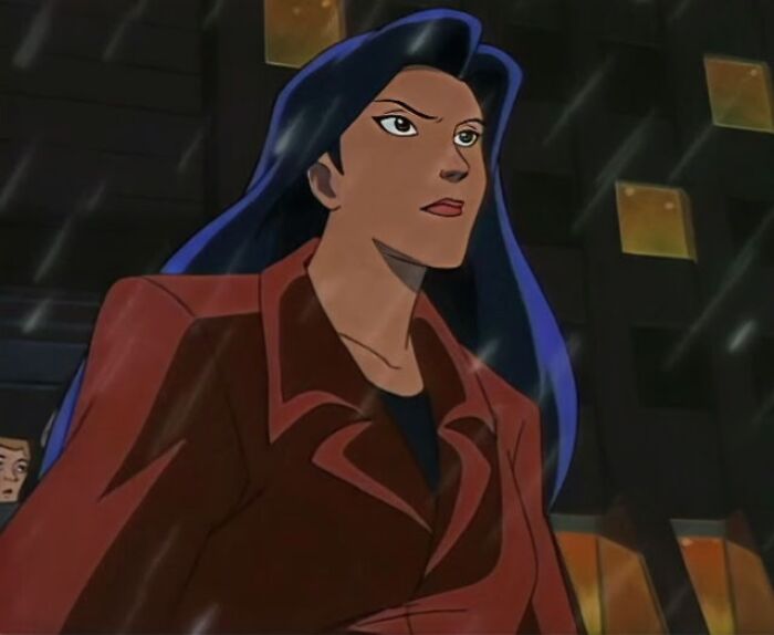 A determined female cartoon character with long dark hair, wearing a red jacket, standing in the rain.