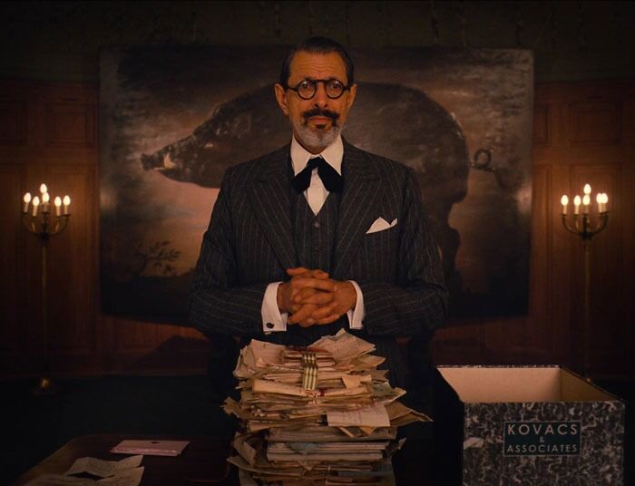 Kovacs in front of the letters 