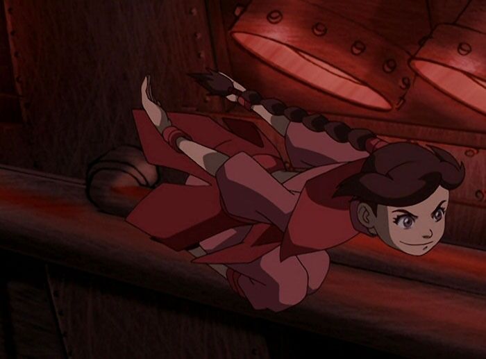 Female cartoon character in action, displaying strength and agility in a dynamic pose.