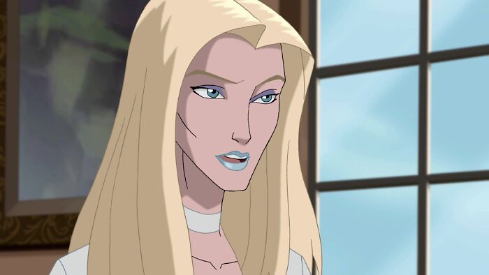 Blonde female cartoon character with a serious expression stands by a window, embodying fame and strength.