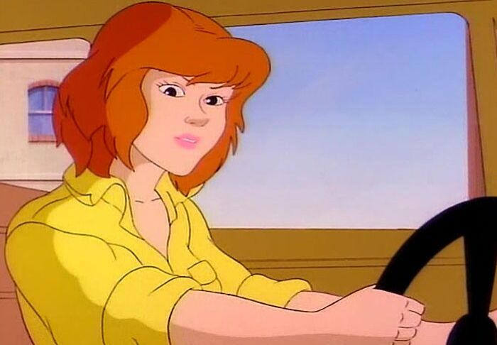 Female cartoon character with orange hair driving a vehicle, showcasing fame and strength.