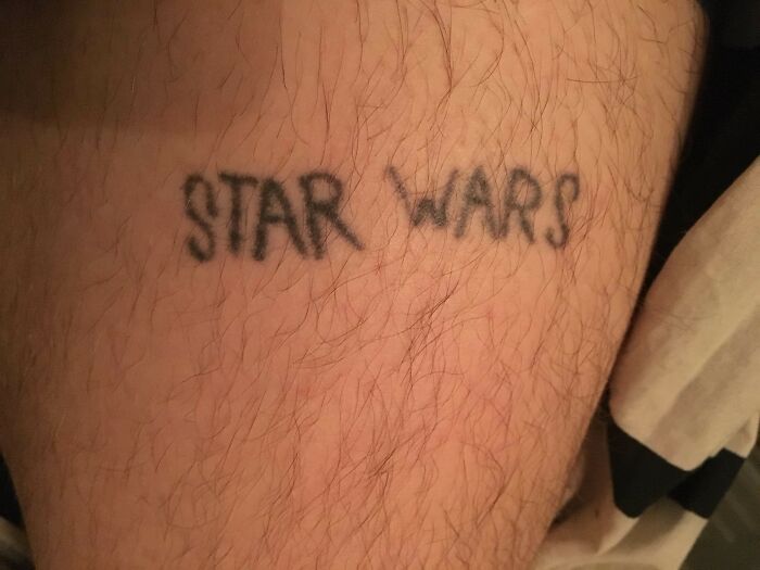 Funny tattoo of "Star Wars" on a person's skin, with a humorous appearance.