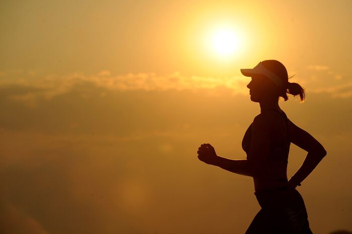 Woman running in the sunset 