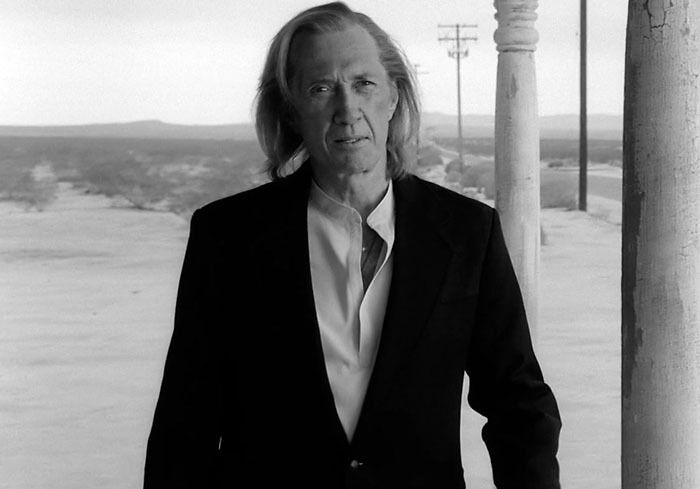 David Carradine in a black jacket from K**l Bill Vol 2, representing famous people who got married multiple times.