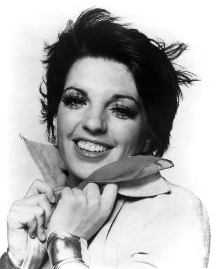 Liza Minnelli smiling in a black and white portrait, representing famous people who got married multiple times.