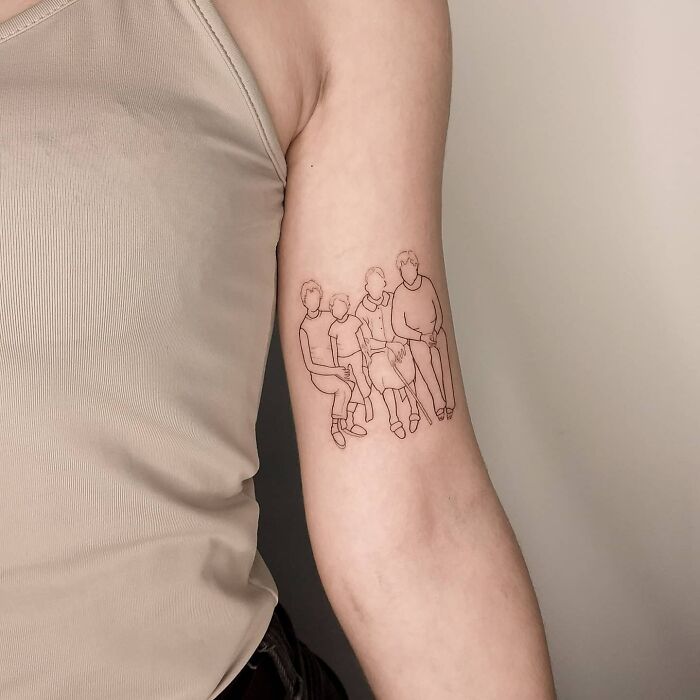 Line art tattoo of a mother and child on an arm, symbolizing the mother-child bond.