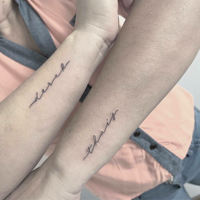 Mother-child bond tattoos on forearms, featuring names in cursive script.