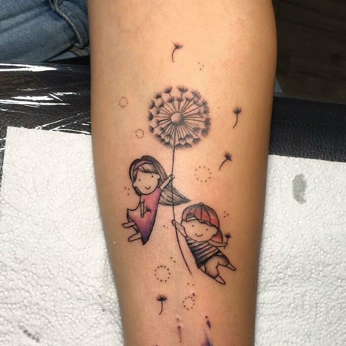 Mom tattoo featuring children holding a dandelion, symbolizing mother-child bond.
