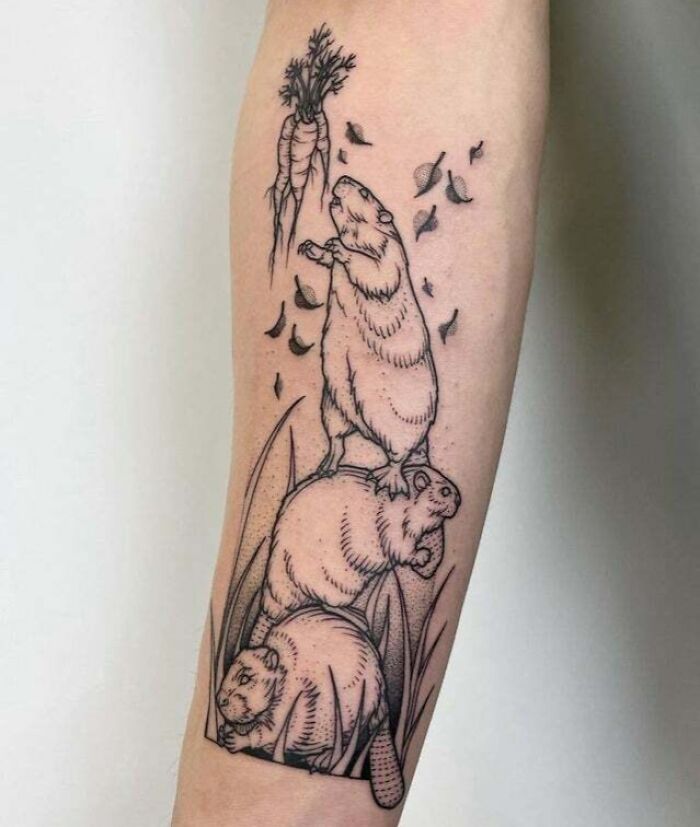 Beaver tattoo on arm depicting three beavers stacking to reach a carrot, symbolizing family bond.