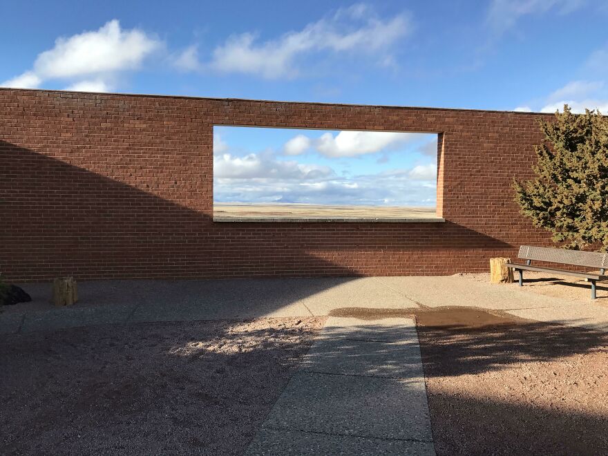 The Opening In This Wall Looks Like A Piece Of Art Hanging On It