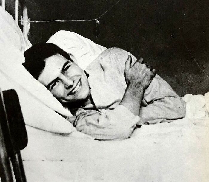 Ernest Hemingway lying on a bed, smiling, featured among famous people who got married multiple times in history.