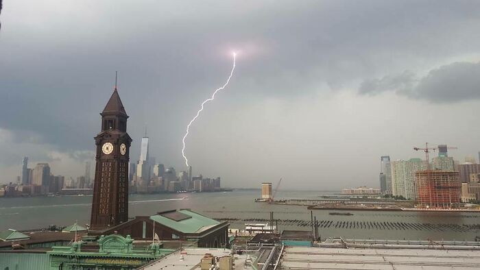 Lightning striking near the New York City skyline, highlighting the unique and striking scenes in New York unlike any other city.