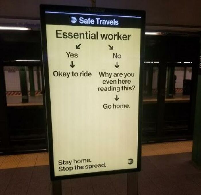 Humorous New York subway sign humorously directing essential workers while encouraging others to stay home and stop the spread.