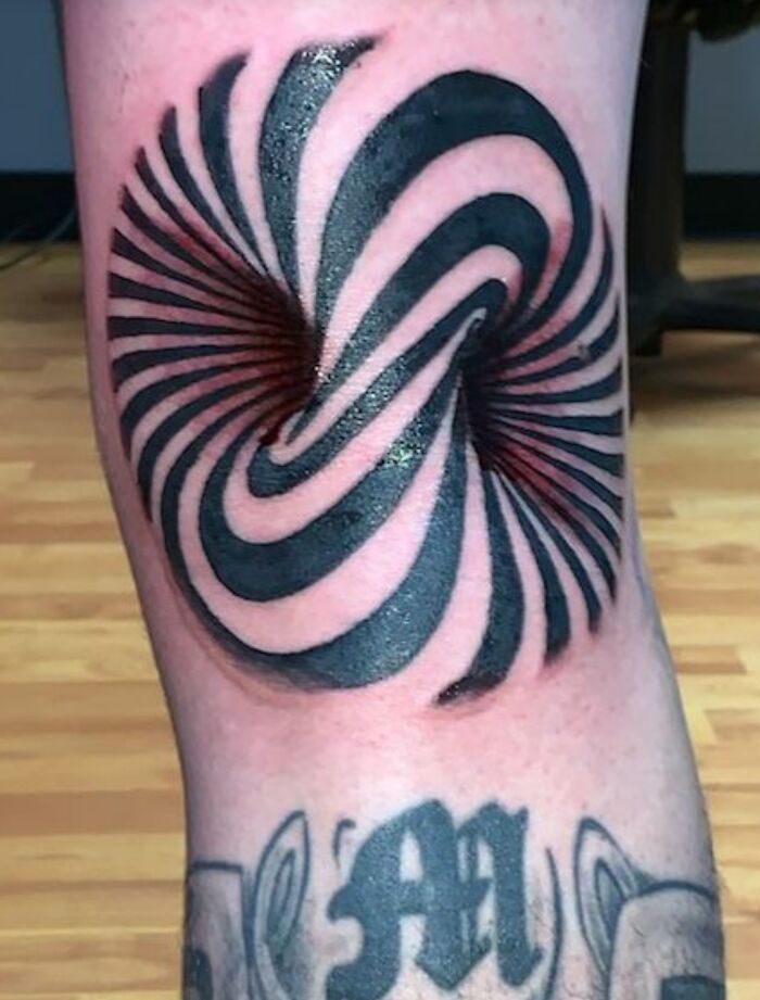 Optical illusion tattoo with eye-catching swirl design on the calf, creating a mind-bending visual effect.