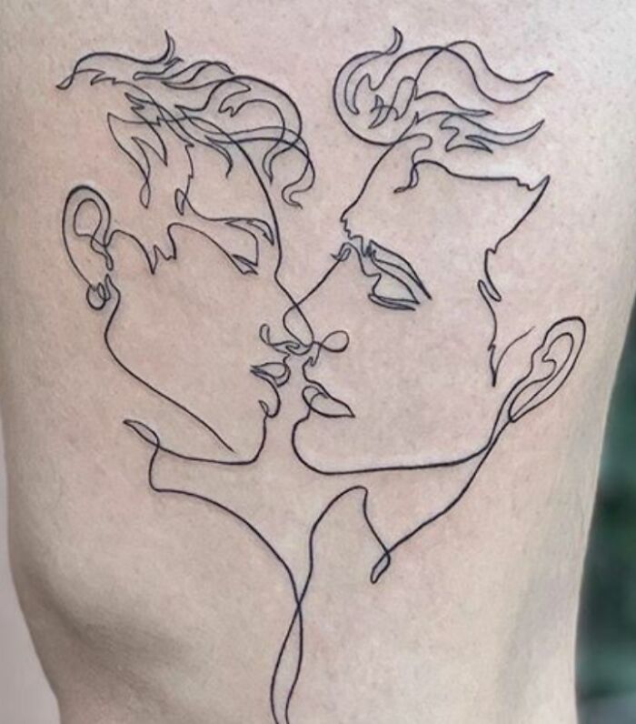 Minimalism line tattoo of two faces in a continuous outline design.