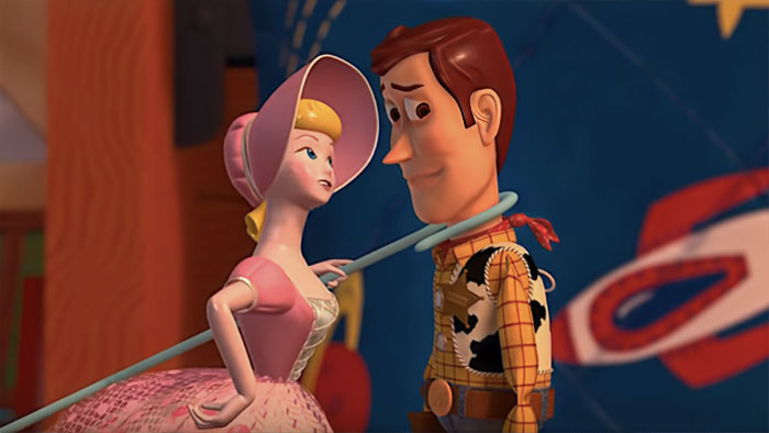 Cartoon couple sharing a loving moment; characters in a lively and colorful setting.