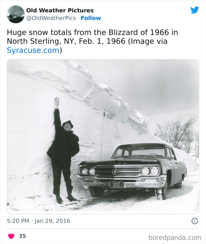 Man measuring extreme snow from 1966 blizzard in North Sterling, NY, showing huge snow totals and vintage car.