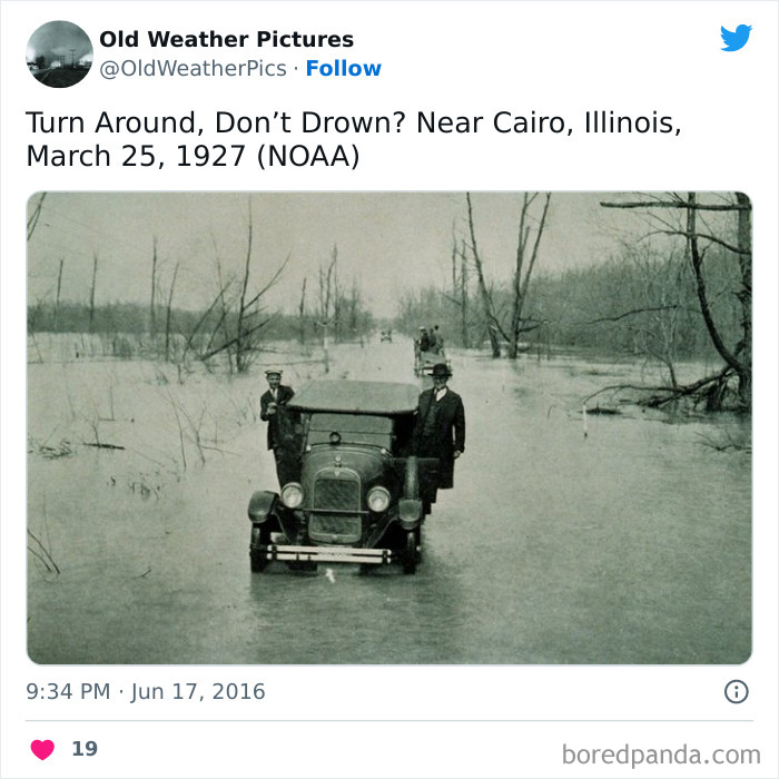 Vintage photo showing extreme flooding with people standing on a car in a flooded road near Cairo Illinois in 1927.