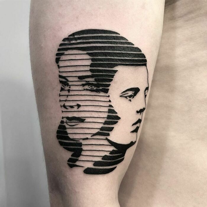 Optical illusion tattoo design featuring overlapping faces with striped pattern.