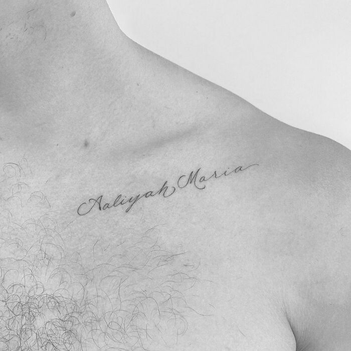 Celebrity tattoo with the name "Aaliyah Maria" written on a person's chest.