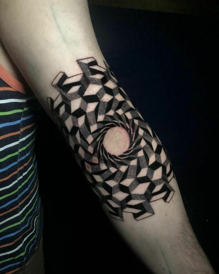 Optical illusion tattoo design on arm with geometric pattern creating a 3D swirl effect.