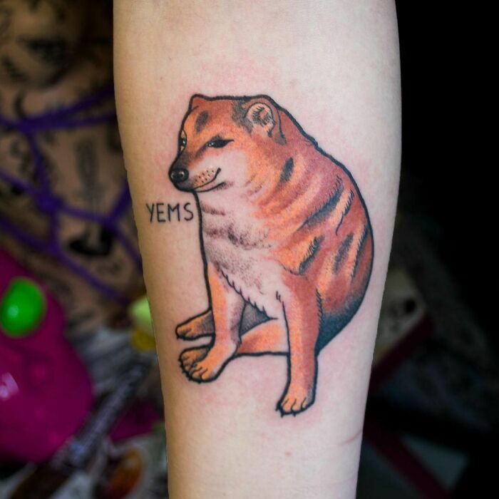 Humorous dog tattoo with "Yems" text, designed to put a smile on your face.