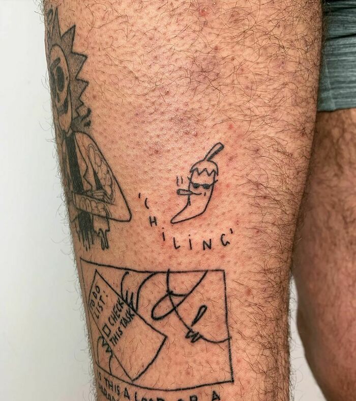 Funny tattoo of a cartoon chili pepper with sunglasses labeled "chiling" on a person's leg.
