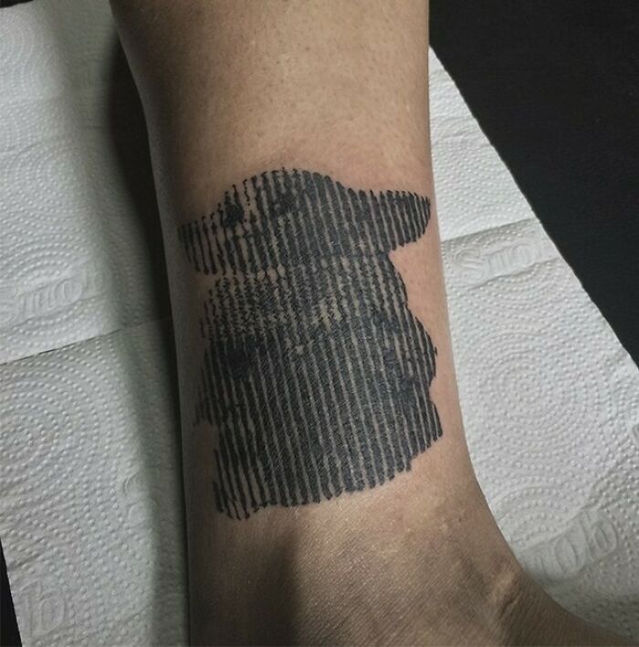 Optical illusion tattoo on an arm with mind-bending design.