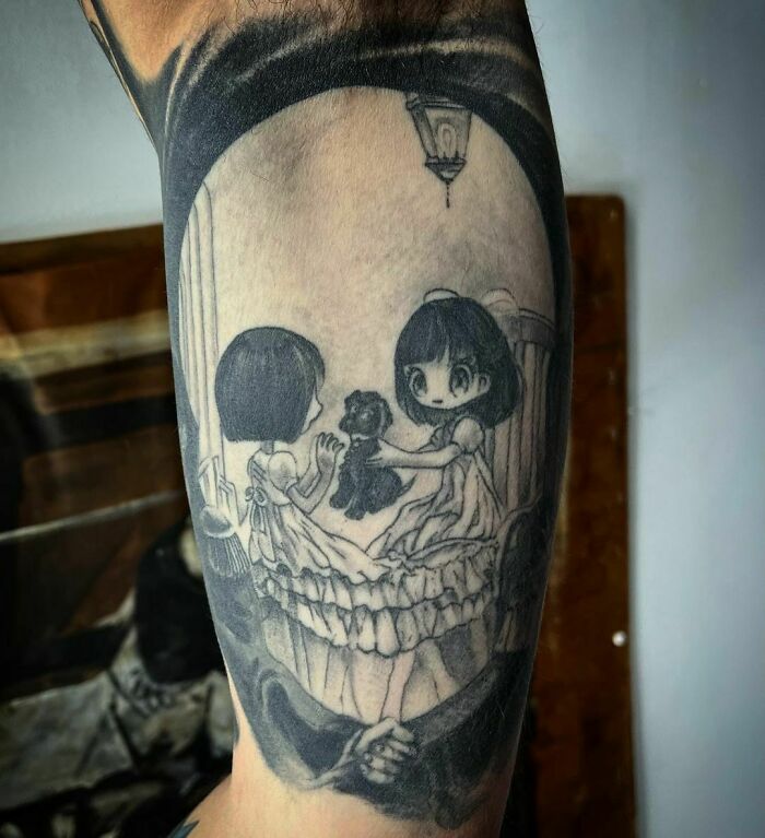 Optical illusion tattoo of two girls with a dog, creating a mind-bending design on an arm.