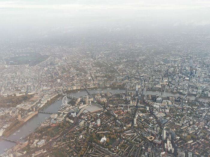 Central London With The Houses Of Parliament, London Eye, Waterloo Station And The River Thames. You May Also See St Paul's Cathedral