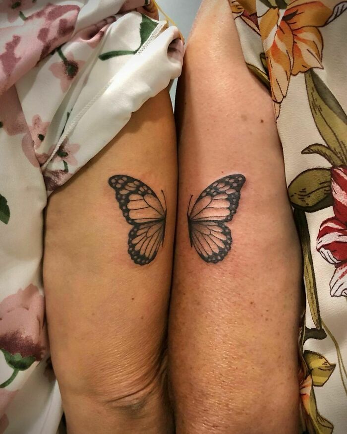Butterfly tattoos on siblings' arms, symbolizing a simple brother and sister tattoo idea.