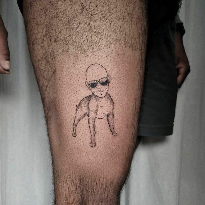 Funny tattoo of a person with sunglasses on a dog's body, designed to make you smile.
