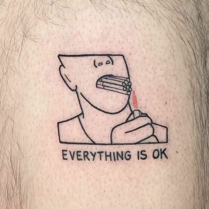 Funny tattoo of a person lighting dynamite in their mouth with text "Everything Is OK."